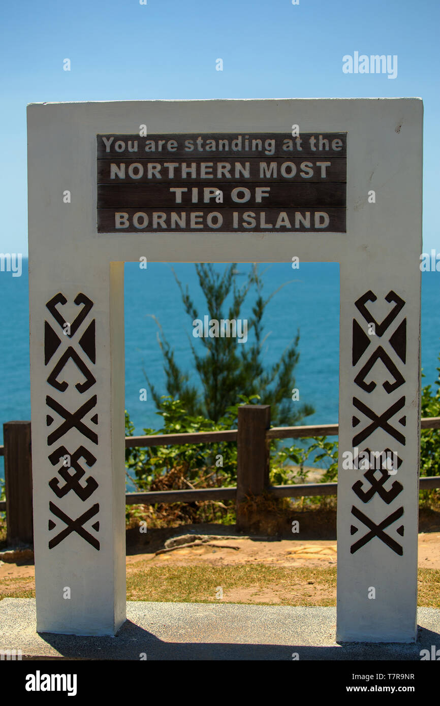 A sign reading ' You are standing at the Northern Most Tip Of Borneo Island' at Simpang Menggayau near Kudat Sabah Malaysia Stock Photo