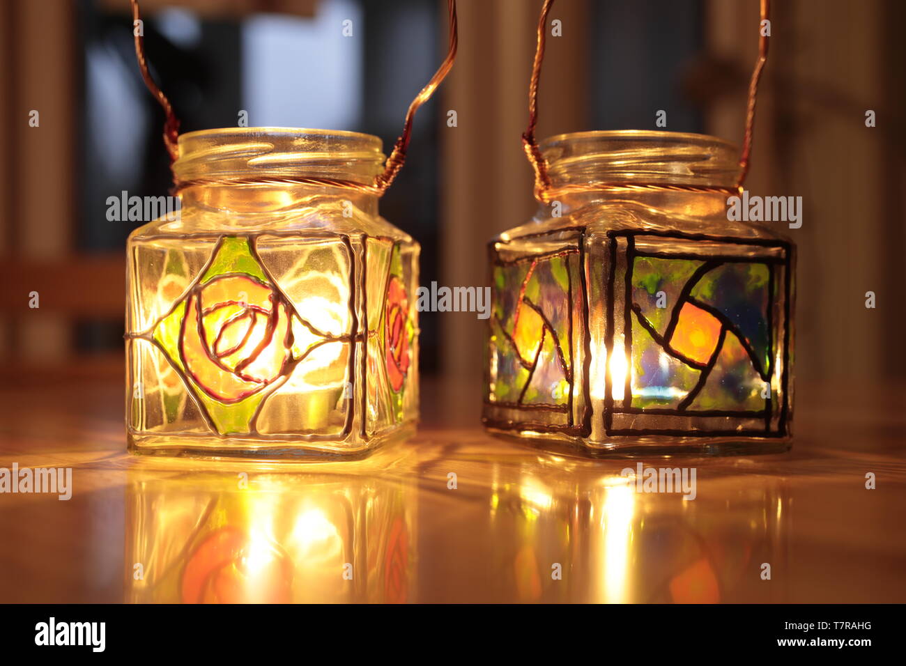 Craft made, stain glassed, jam jar candle holders Stock Photo Alamy