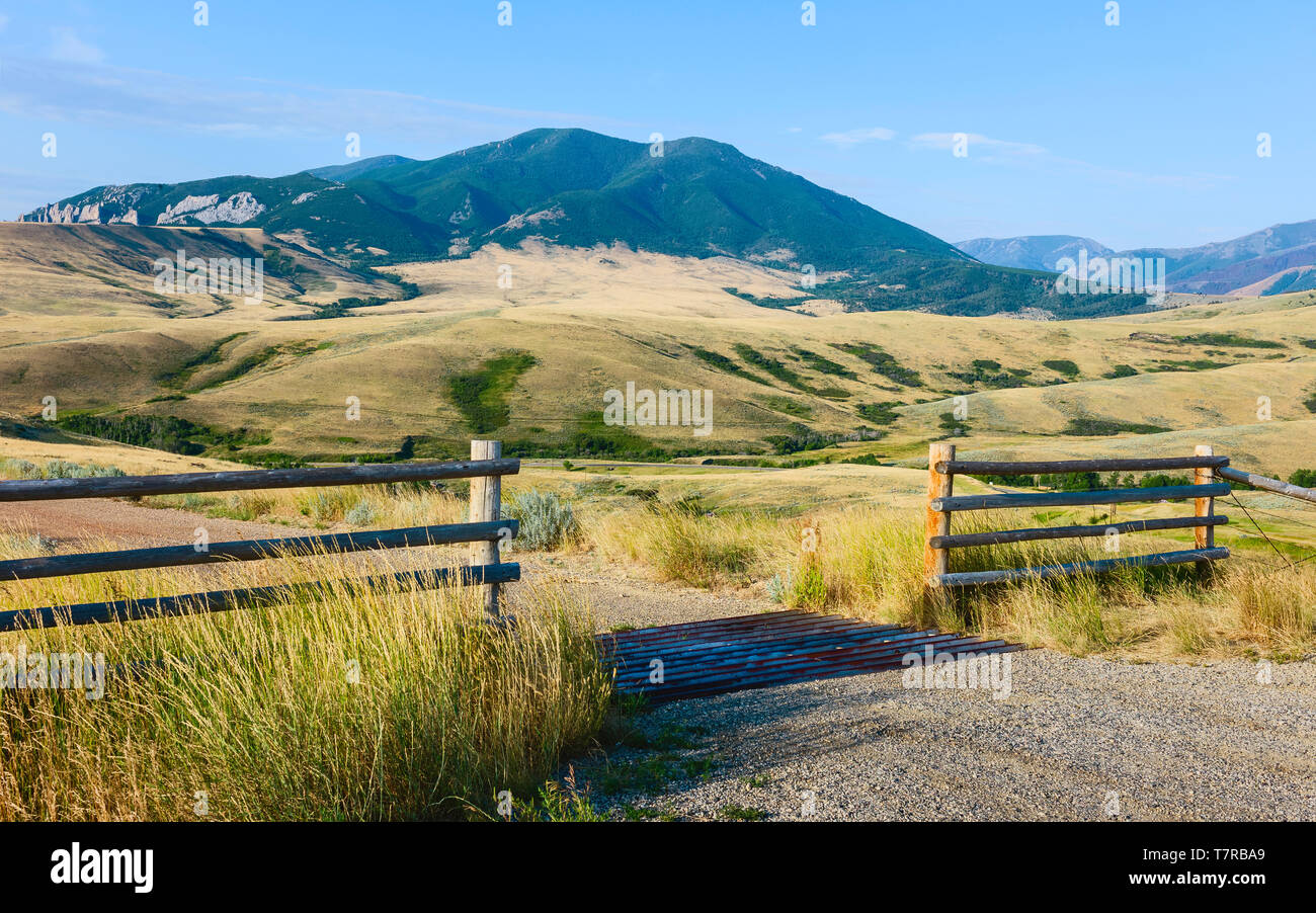 Foothills of Bear Tooth Mountains on a summer day with sagebrush and grassland as viewed from the Bear Tooth Mountain pass highway, Cooke City, USA. Stock Photo