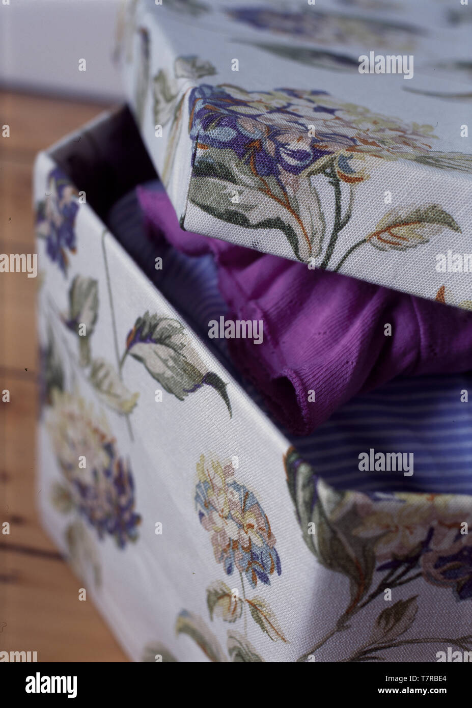 Close-up of cardboard storage box covered with wallpaper Stock Photo