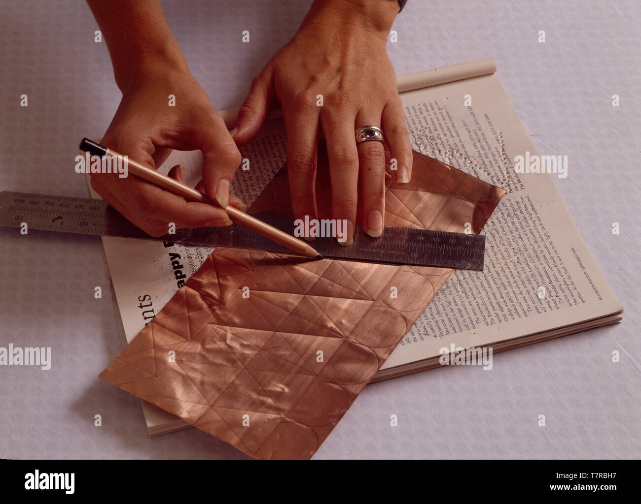 Hands Measuring A Copper Strip Stock Photo 245761747 Alamy