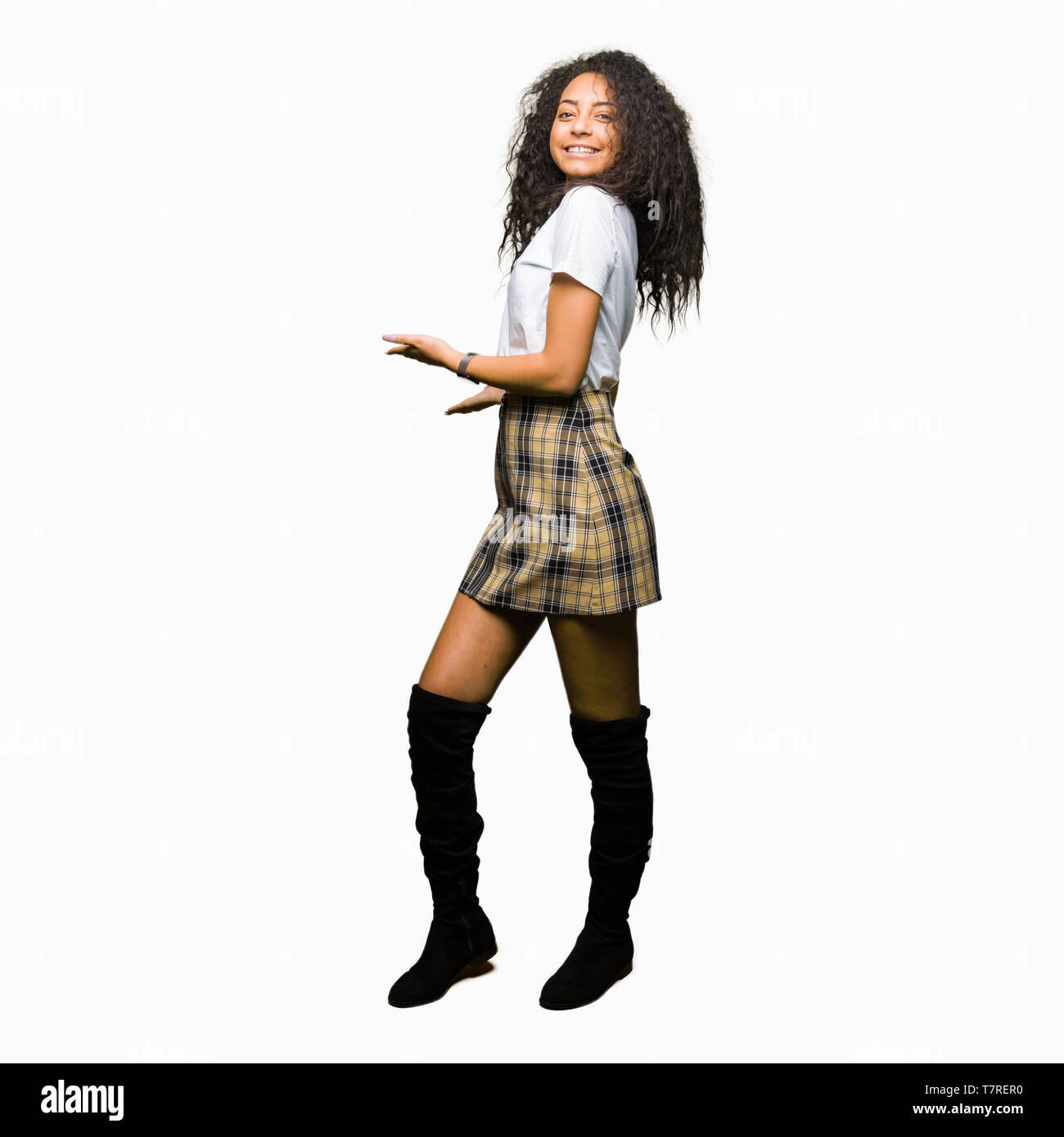Young Beautiful Girl With Curly Hair Wearing Casual White T Shirt