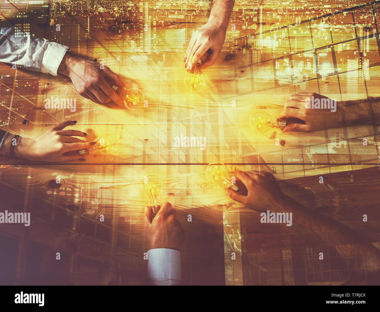 Teamwork and brainstorming concept with businessmen that share an idea with a lamp. Concept company startup. Double exposure Stock Photo