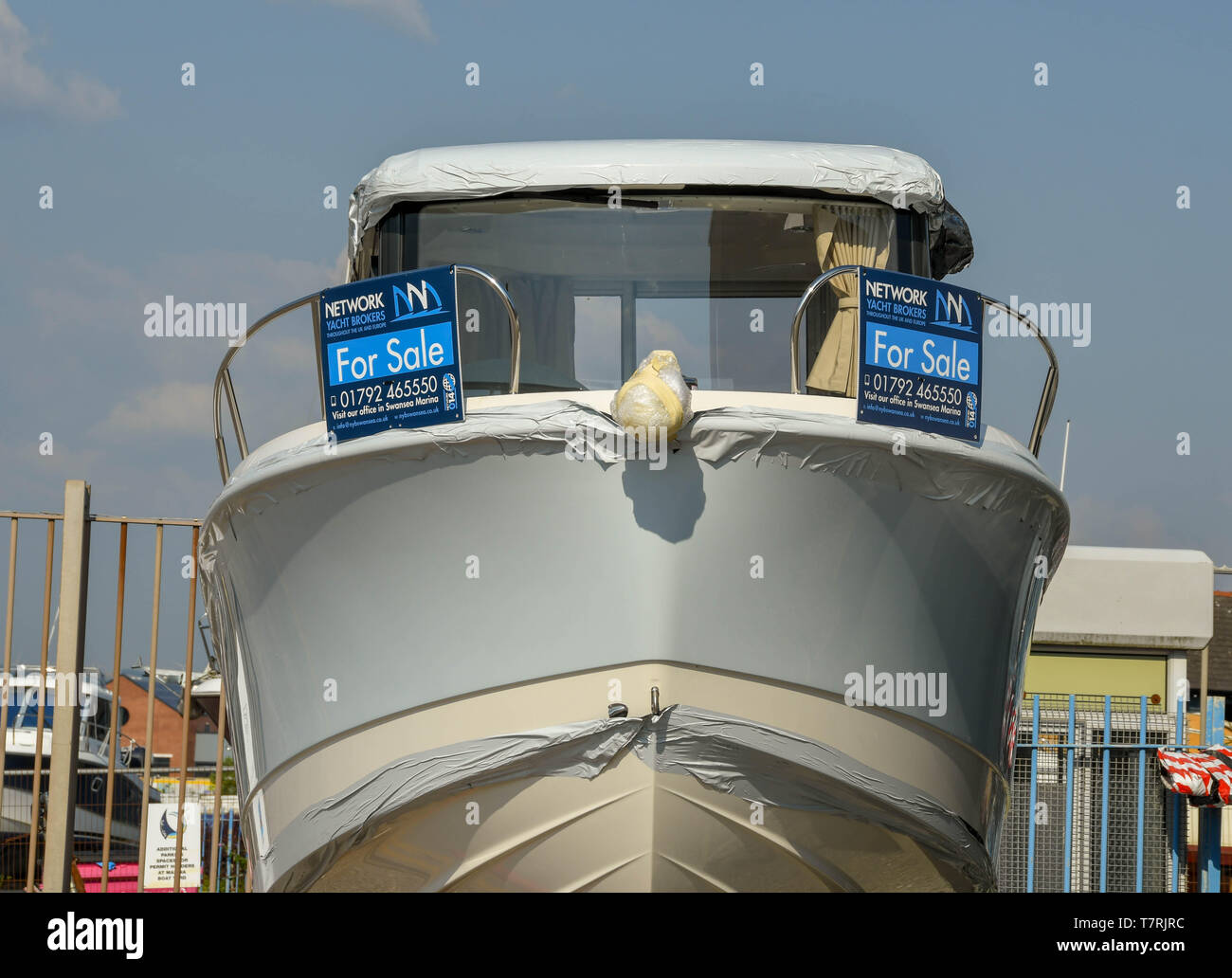 SWANSEA, WALES JULY 2018 Small motor boat for sale in a boat yard in