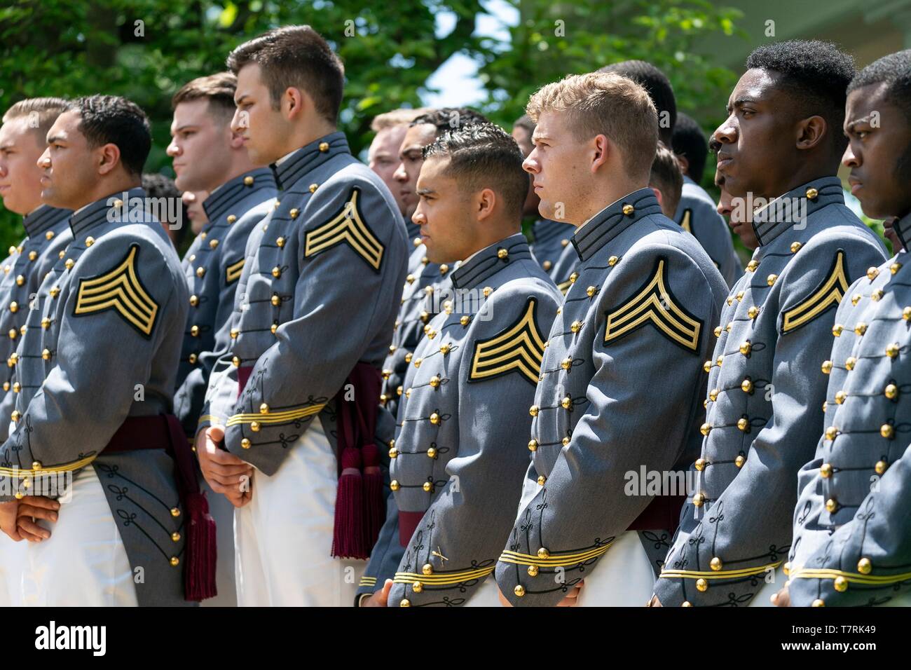 Members of the Army Black Knights, the U.S. Military Academy football team, listen to U.S President Donald Trump during the Commander in Chiefs trophy presentation at the Rose Garden of the White House May 6, 2019 in Washington, DC. Stock Photo