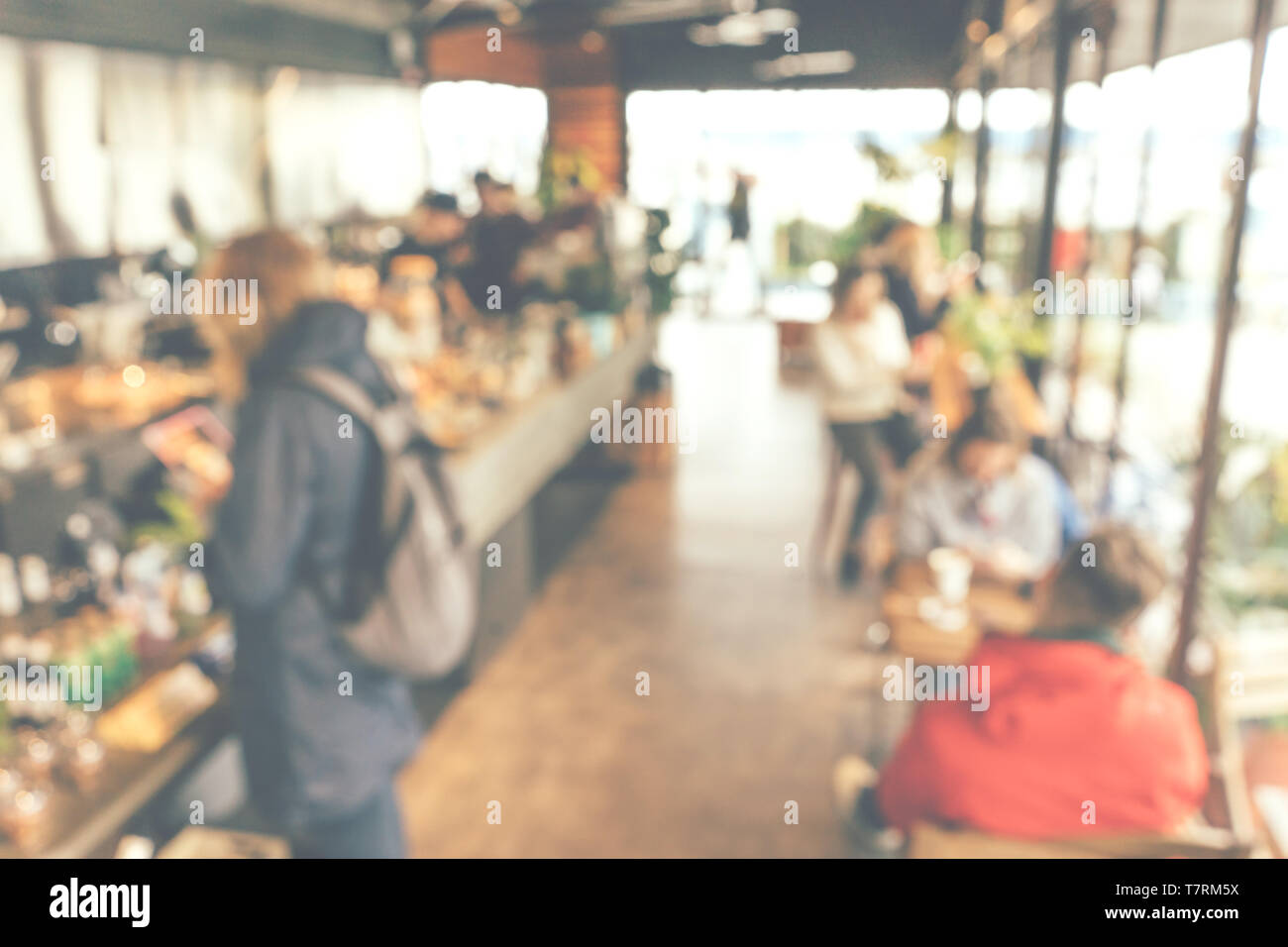 Defocus or blured restaurant with people, modern coffee house