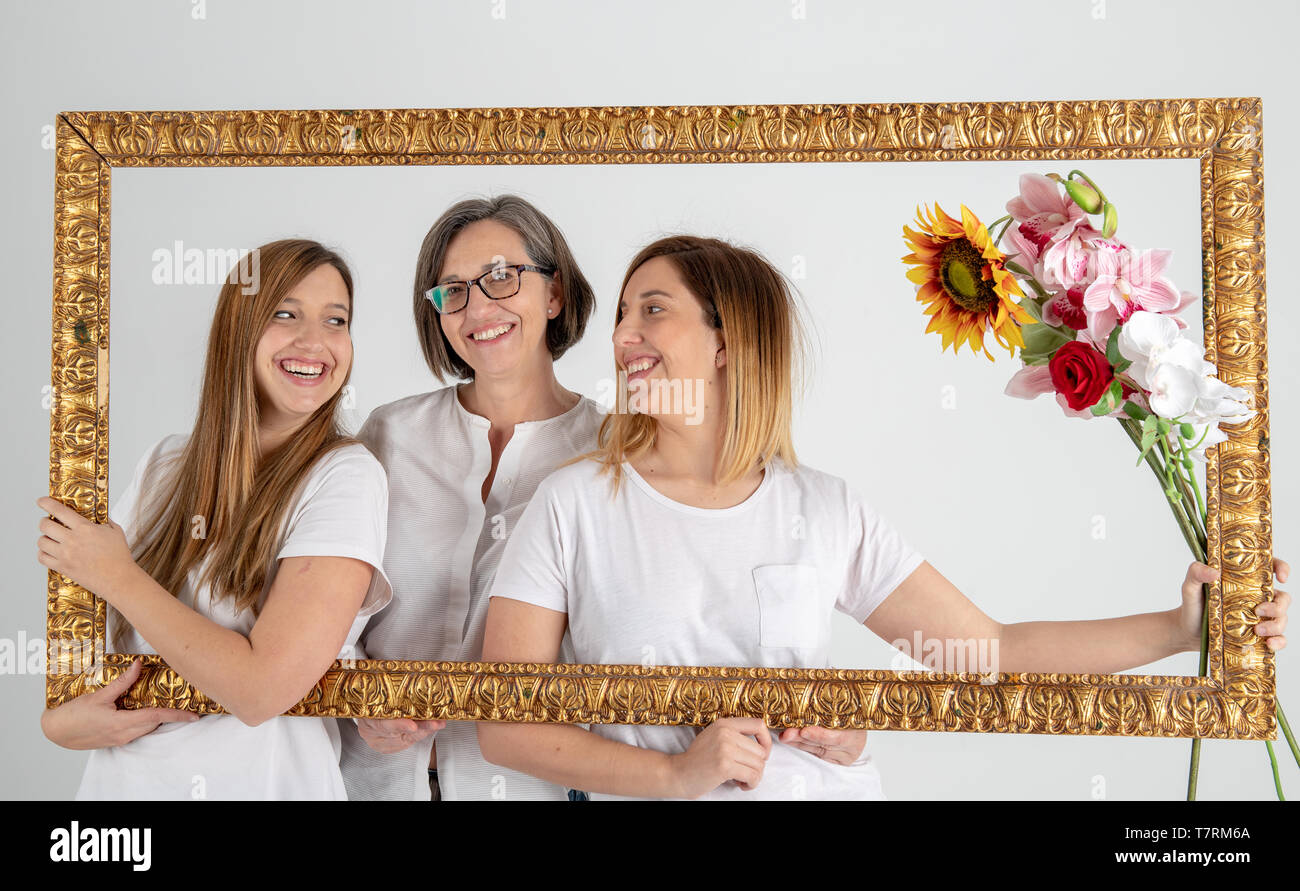 Family composed by mother and two twin sisters pose inside a pictorial ...