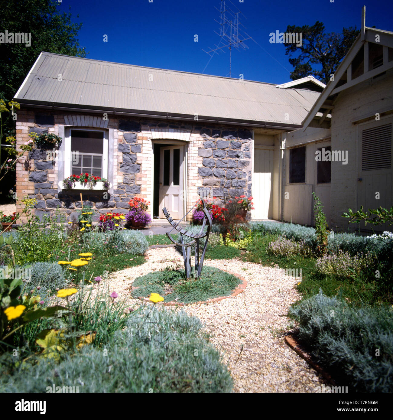 Gravel Paths Through Small Formal Front Garden Of A Single Storey