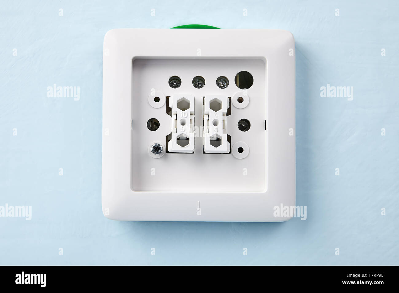 New light switch in process of installation, electric work Stock Photo