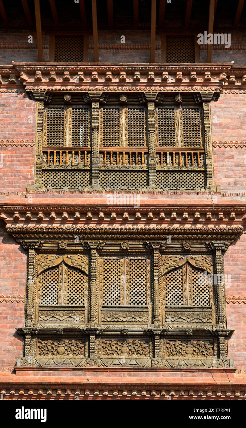 Elaborately carved wooden windows in the traditional Newar style, Kathmandu, Nepal Stock Photo