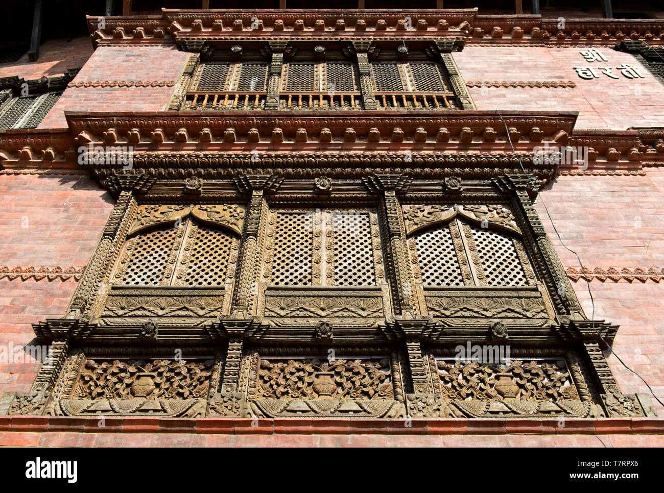Elaborately carved wooden windows in the traditional Newar style, Kathmandu, Nepal Stock Photo