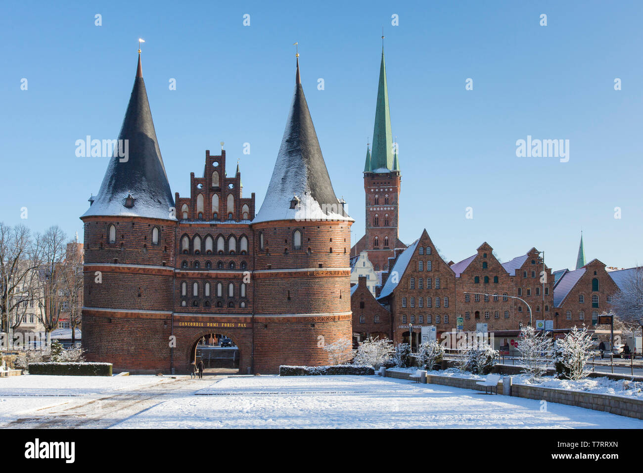 The Brick Gothic city gate Holstentor/ Holstein Gate in the Hanseatic town Lübeck in winter, Schleswig-Holstein, Germany Stock Photo