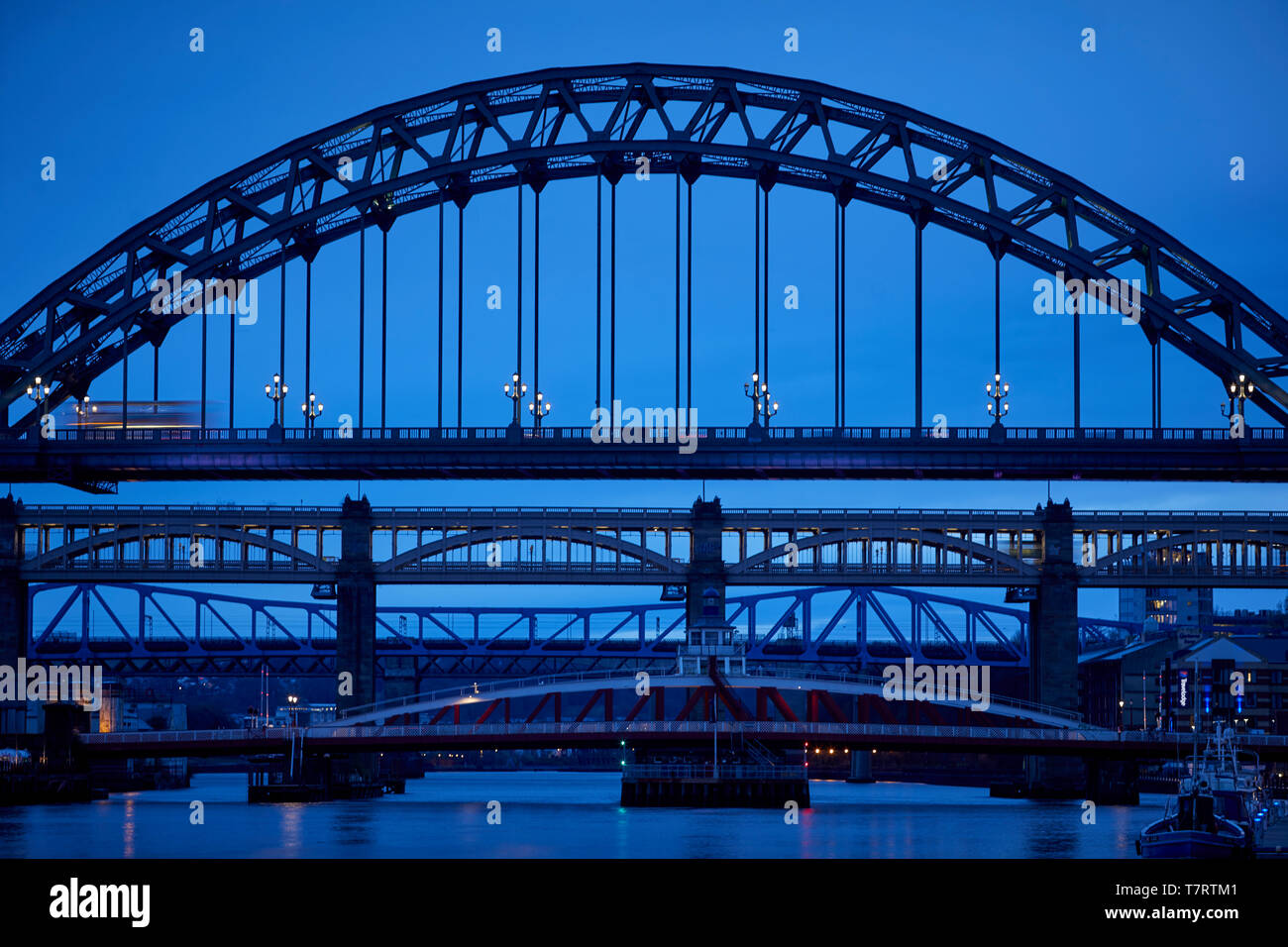 Iconic Newcastle upon Tyne  Quayside waterfront  landmark Tyne Bridge, Swing Bridge, High Level bridge and beyond is King Edward VII Bridge Stock Photo