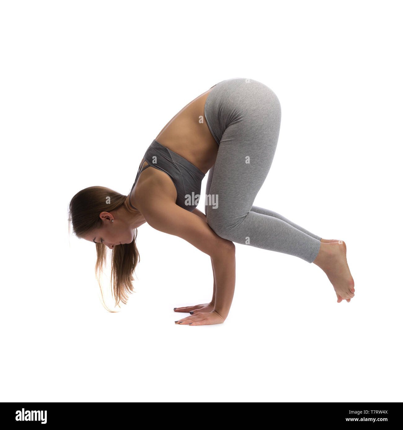 Woman practicing yoga in a studio isolated on a white background Stock ...
