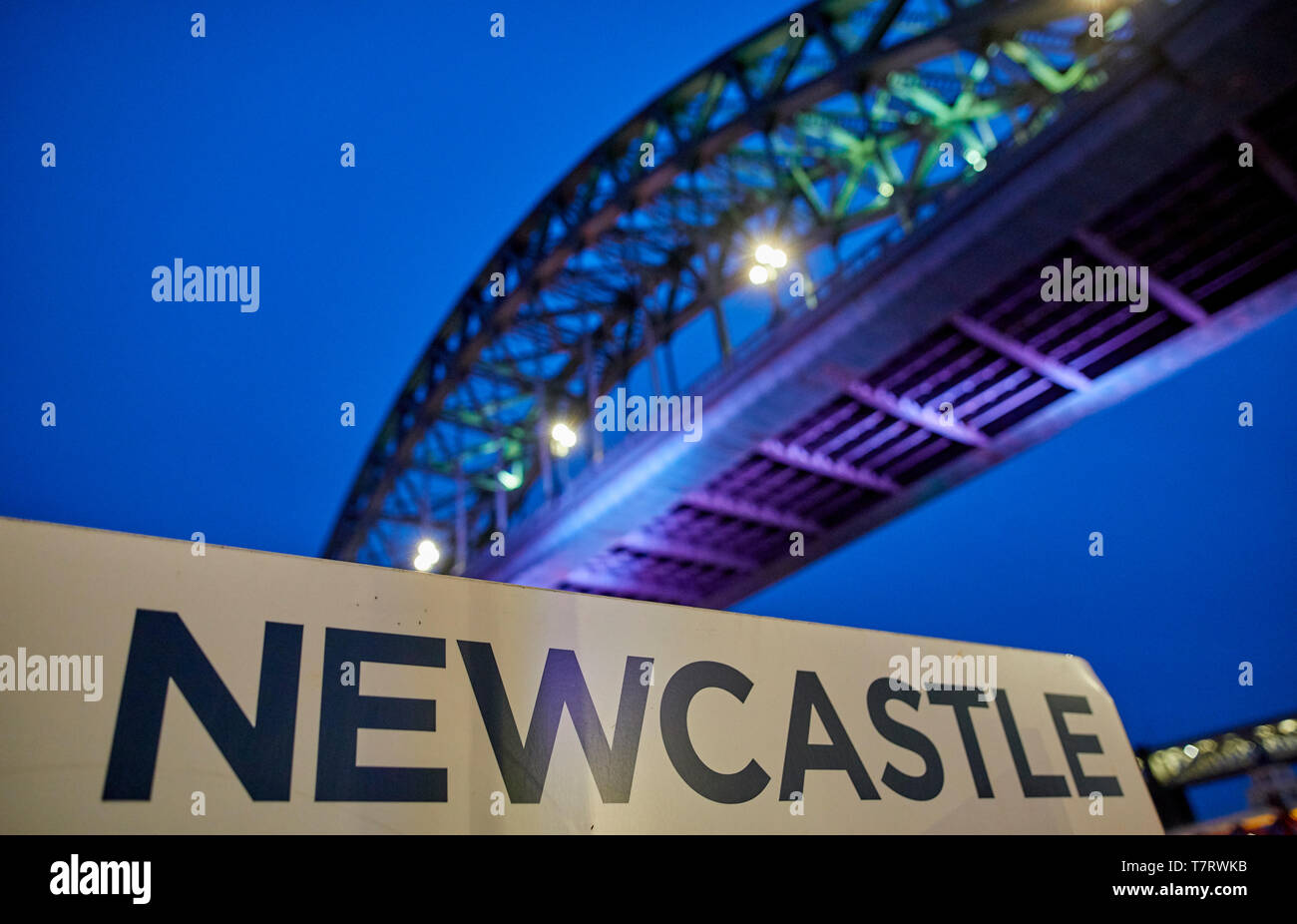 Iconic Newcastle upon Tyne  Quayside waterfront  landmark Tyne Bridge crossing the river Tyne and Sage Gateshead looking to the Tyne Bridge Stock Photo