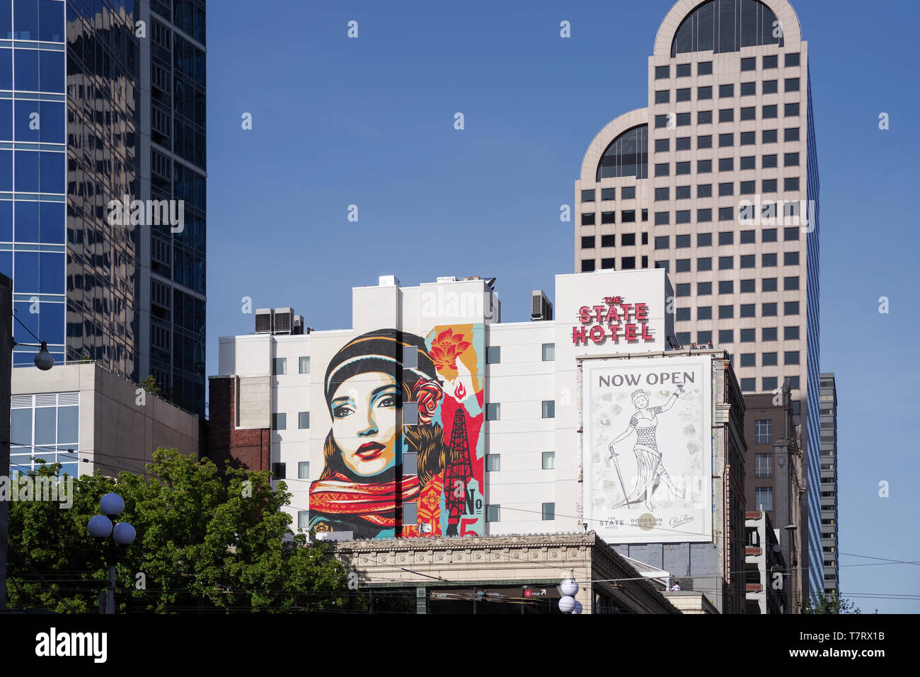 Mural by artist Shephard Fairey on the side of the State Hotel overlooking Pike Place Market - Seattle, Washington State, USA Stock Photo