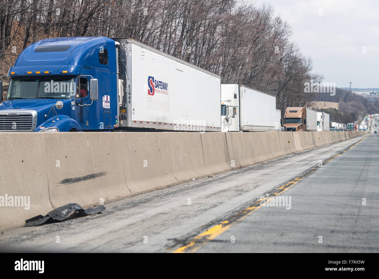 Greenwich, USA - April 6, 2018: Traffic with Safeway trucking corporation trucks on highway 78 in Pennsylvania with cars standing waiting on cloudy da Stock Photo