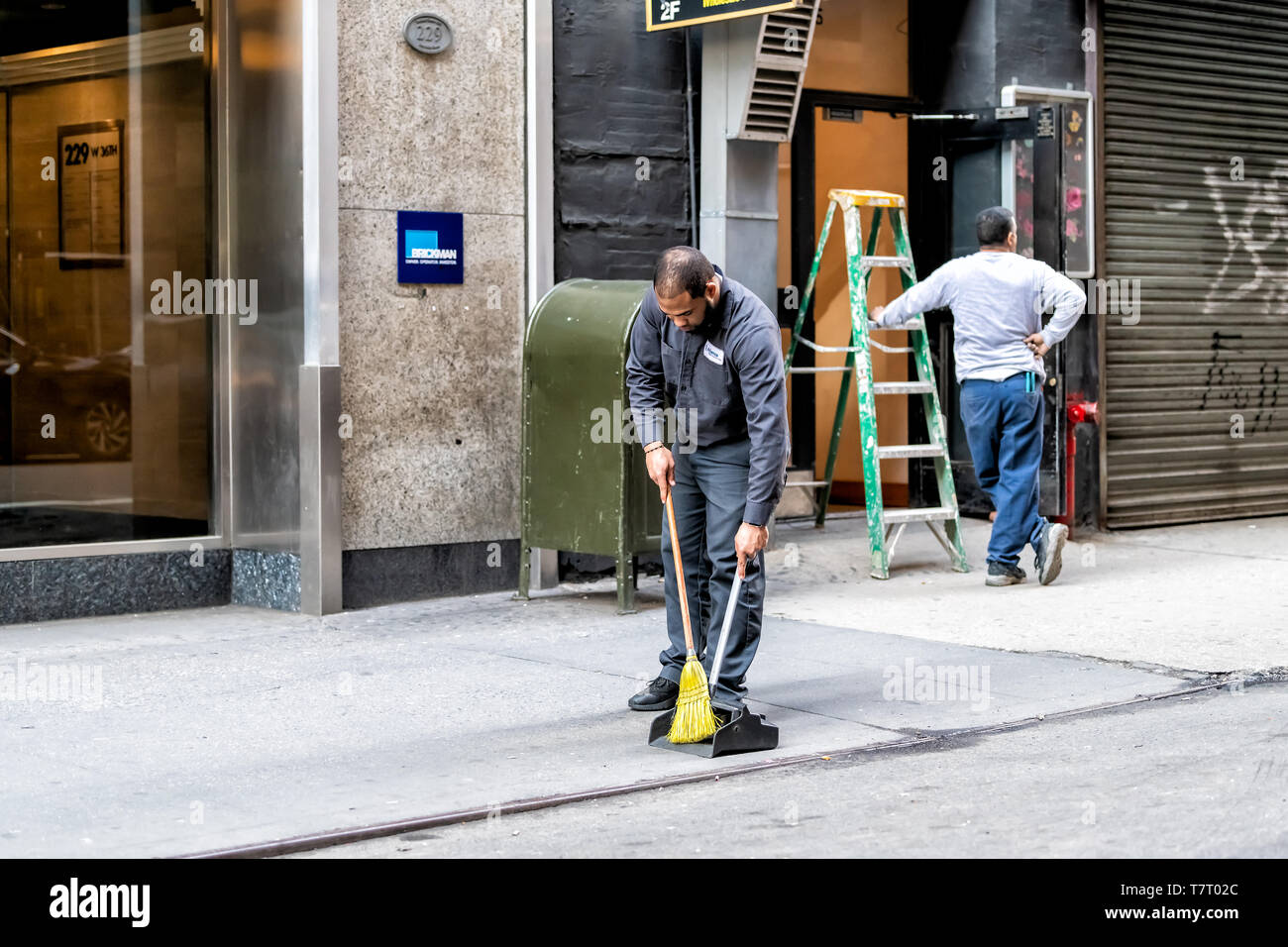 New York City April 6, 2018 People workers on sidewalk pavement