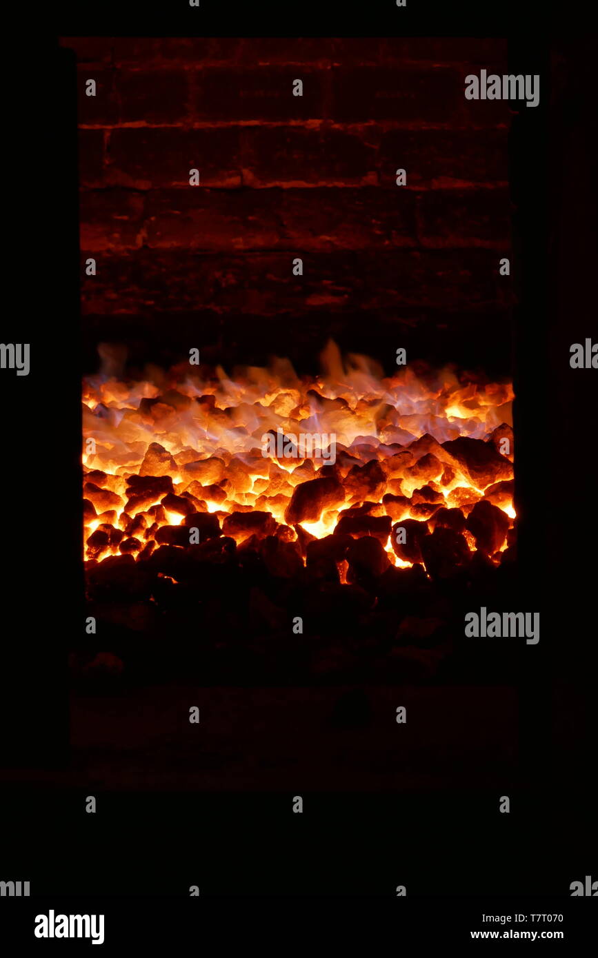 Coal fire in a brick kiln Stock Photo
