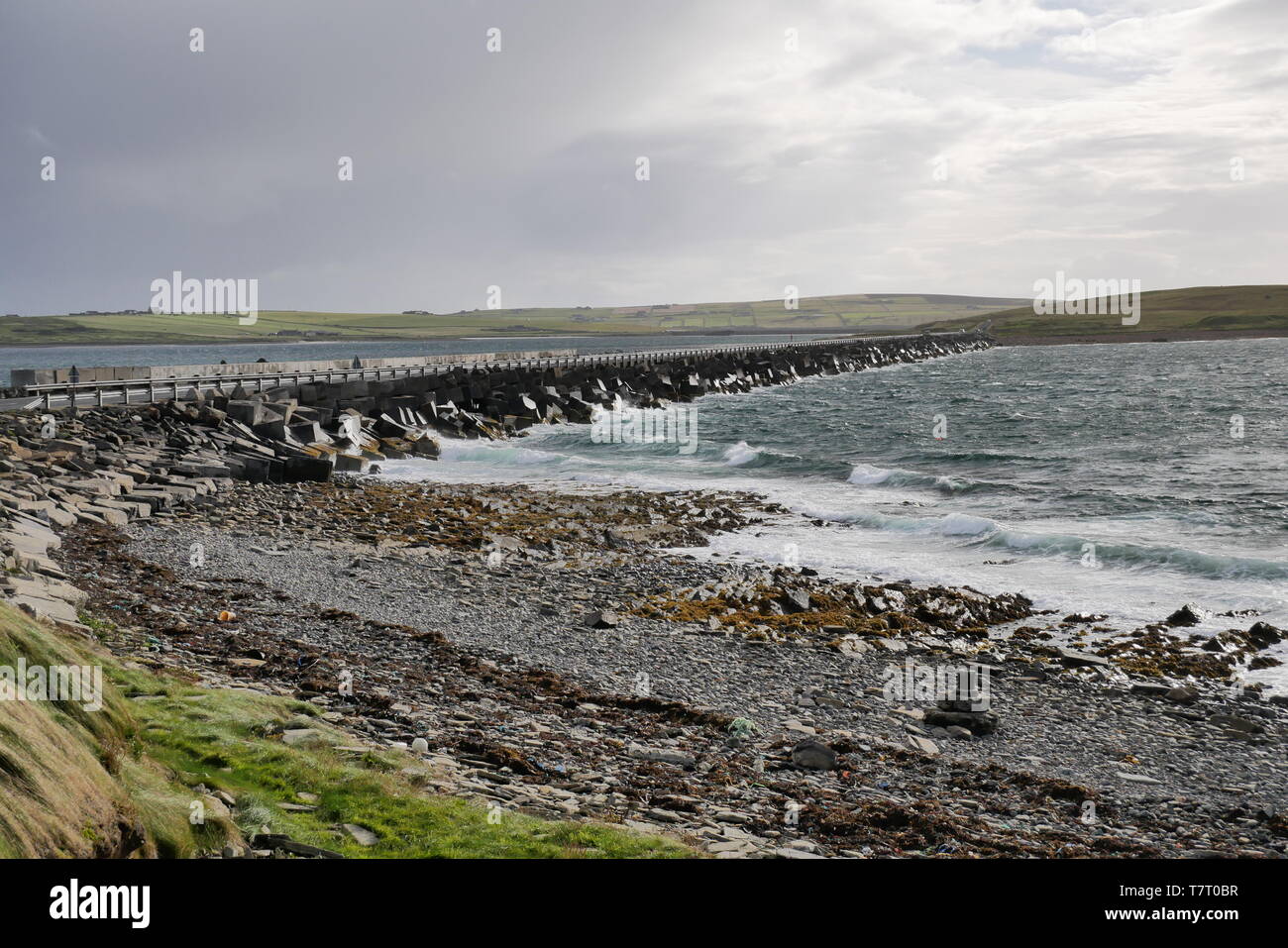 A roadway across a Churchill Barrier in the Orkney Islands in Scotland, UK Stock Photo