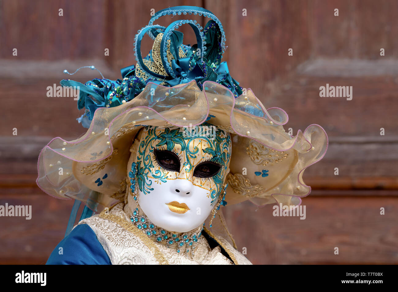 Reveller In Traditional Elaborate Mask And Costume At Venice Carnival (Carnevale di Venezia). Venice, Veneto, Italy, Europe Stock Photo