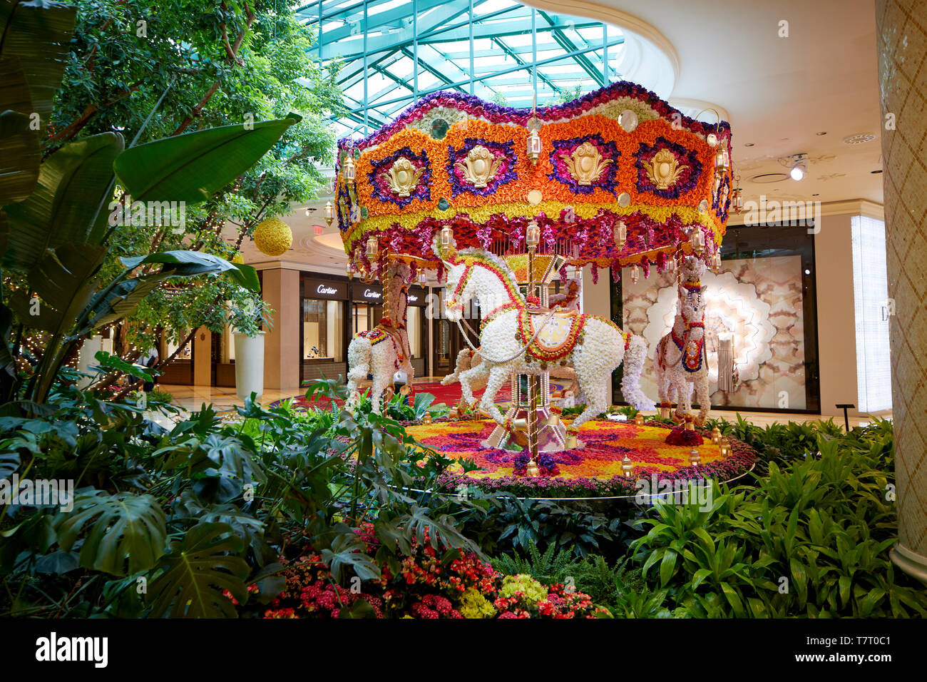 Las Vegas, Paradise, Nevada USA, Five star Wynn hotel and Casino decorated forest walkway with flower carousel Stock Photo