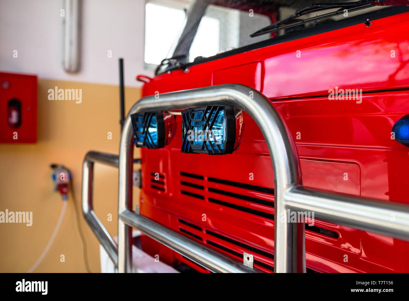The front of the truck of an old Polish fire truck with visible blue light signals and chromed grill. Stock Photo