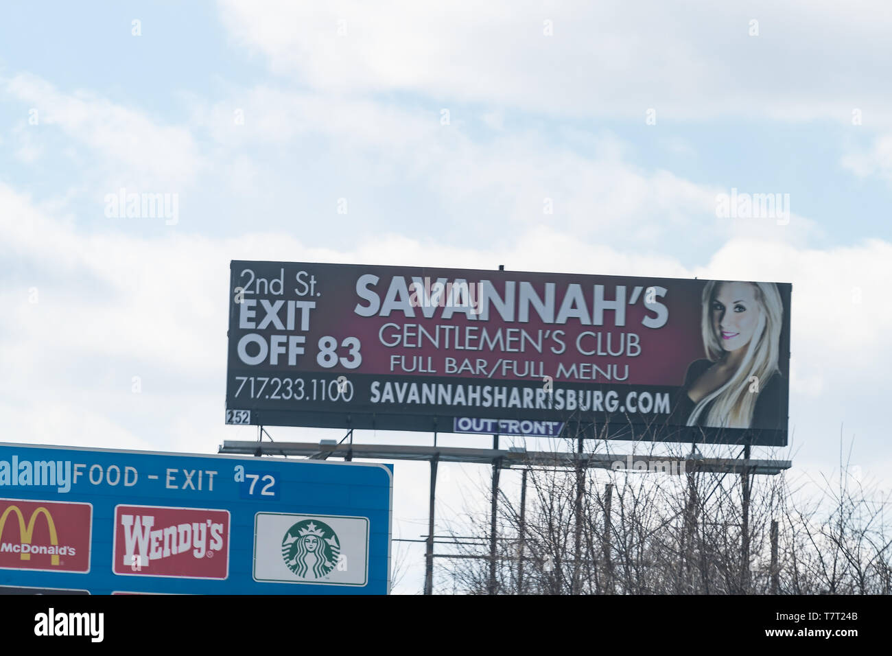 Lower Paxton Township, USA - April 8, 2018: Advertisement billboard for Savannah's gentlemen club bar and restaurant along interstate highway road 81  Stock Photo