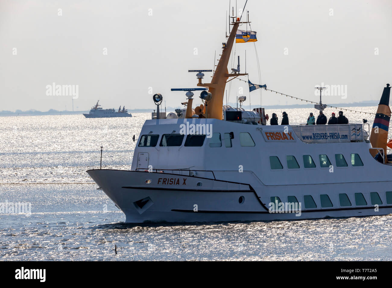Ferry in the Wadden Sea, in front of the North Sea island of Juist, East Frisia, Lower Saxony, Germany, Stock Photo