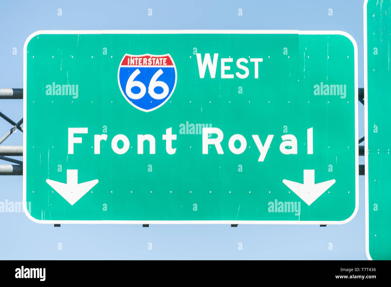 Green road sign to Front Royal city town and interstate highway 66 West in state of Virginia Stock Photo