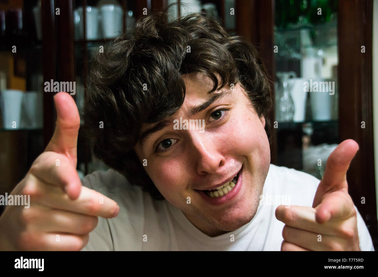 Crazy young man acting comedic Stock Photo