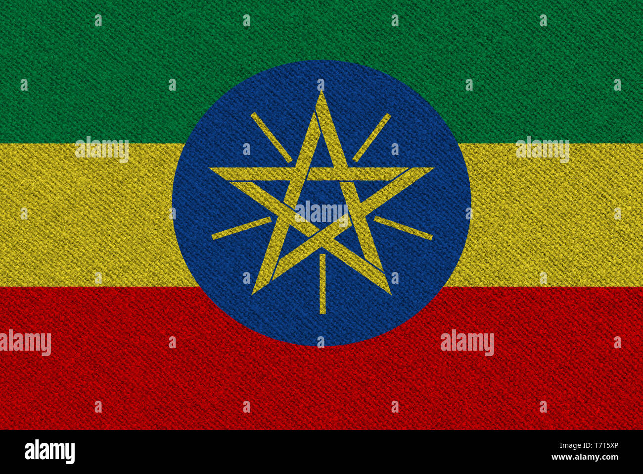 Ethiopia fabric flag. Patriotic background. National flag of Ethiopia