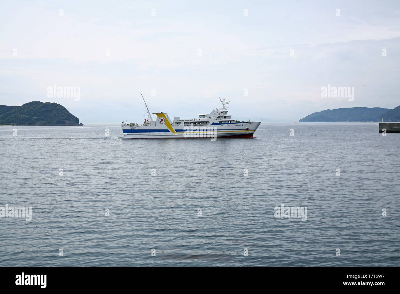 ferry docking in calm Seto Sea, Misaki harbor Ehime Japan Stock Photo