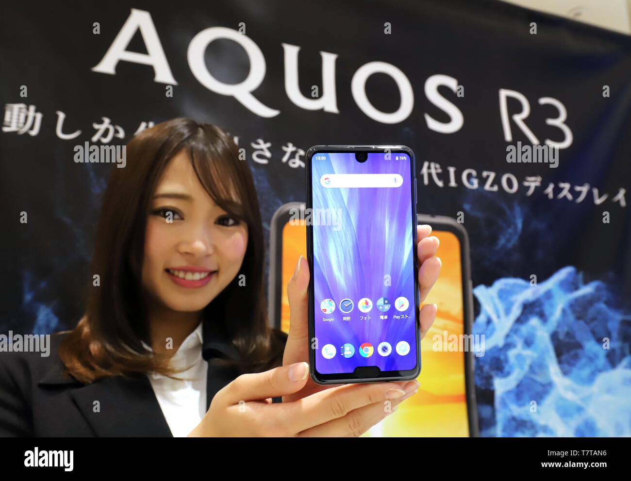 Tokyo, Japan. 8th May, 2019. Japanese electronics giant Sharp employee displays the company's new smart phone 'AQUOS R3' which will go on sale this summer at the company's Tokyo office on Wednesday, May 8, 2019. The new AQUOS smart phone has newly developed 6.2-inch sized IGZO LCD on its display which can reproduce 1 billion color images. Credit: Yoshio Tsunoda/AFLO/Alamy Live News Stock Photo