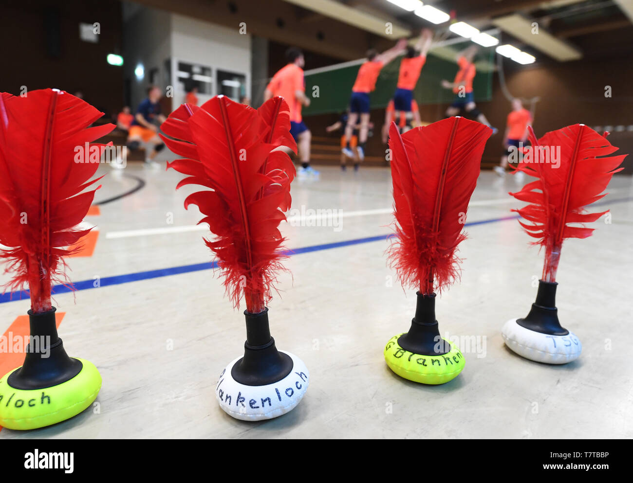 Stutensee, Germany. 07th May, 2019. Members of the TSG Blankenloch sports  club train Indiaca, with Indiaca balls on the indoor floor in the  foreground. Three days a week Indiaca is trained, most