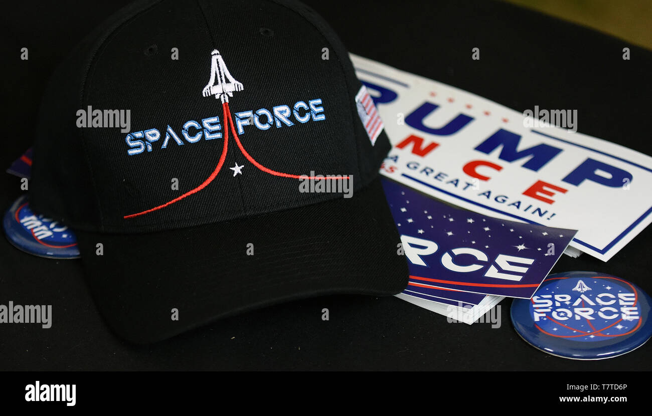 Florida, USA. 08th May, 2019. Campaign items including buttons, hats, and bumper stickers are seen at a merchandise booth at a Make America Great Again rally at the Aaron Bessant Park  Amphitheater on May 8, 2019 in Panama City Beach, Florida. Credit: Paul Hennessy/Alamy Live News Stock Photo