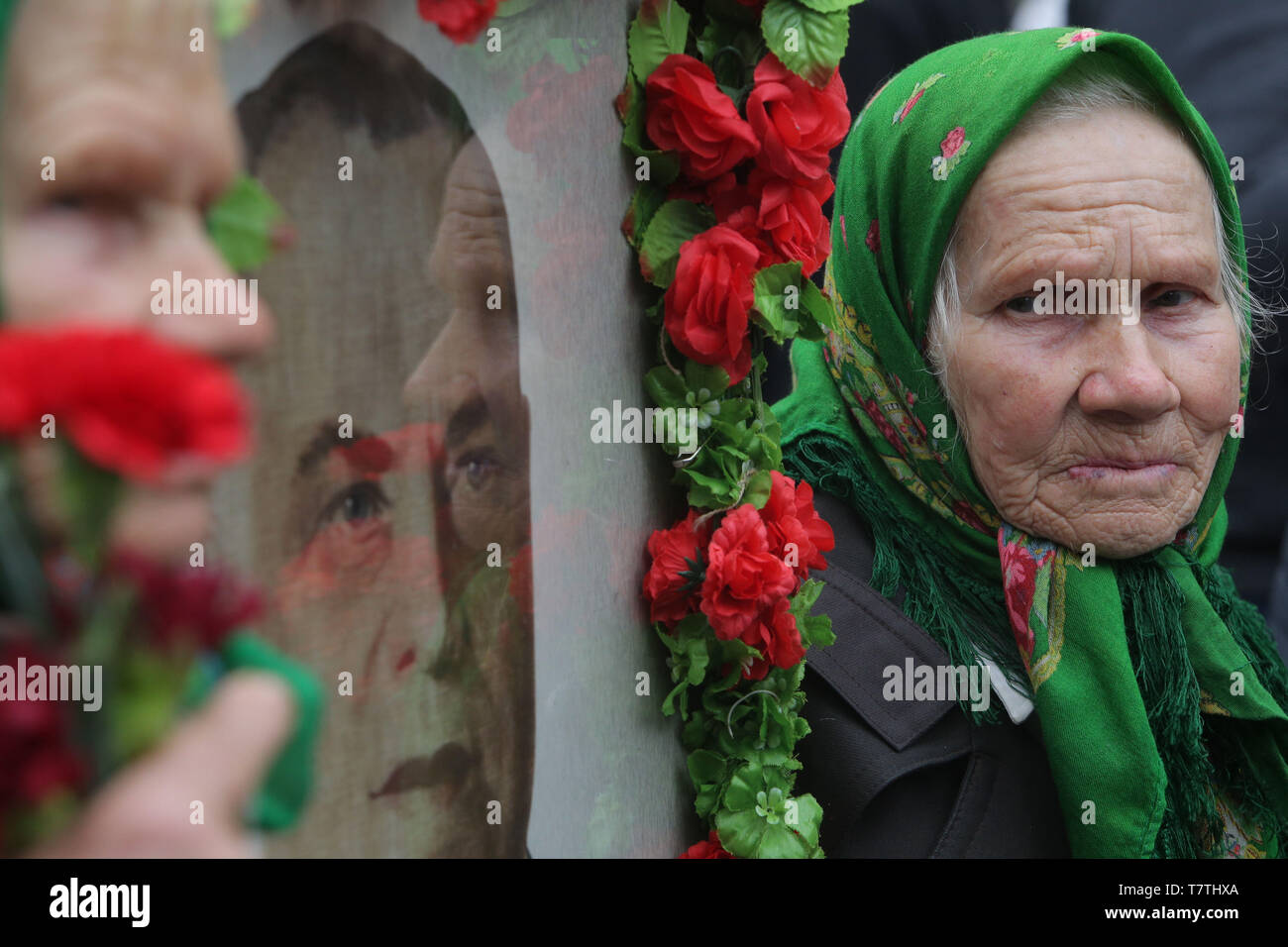May 9, 2019 - Two elderly hold a portrait of Soviet Red Army General, who ultimately commanding the 1st Belorussian Front in the Battle of Berlin Georgy Zhukov, as they participate ''The Immortal Regiment''march in Kyiv, Ukraine, May 9, 2019. Ukraine commemorates the 74th anniversary of the victory in the war of Soviet Union over the Nazis Germany. (Credit Image: © Sergii KharchenkoZUMA Wire) Stock Photo