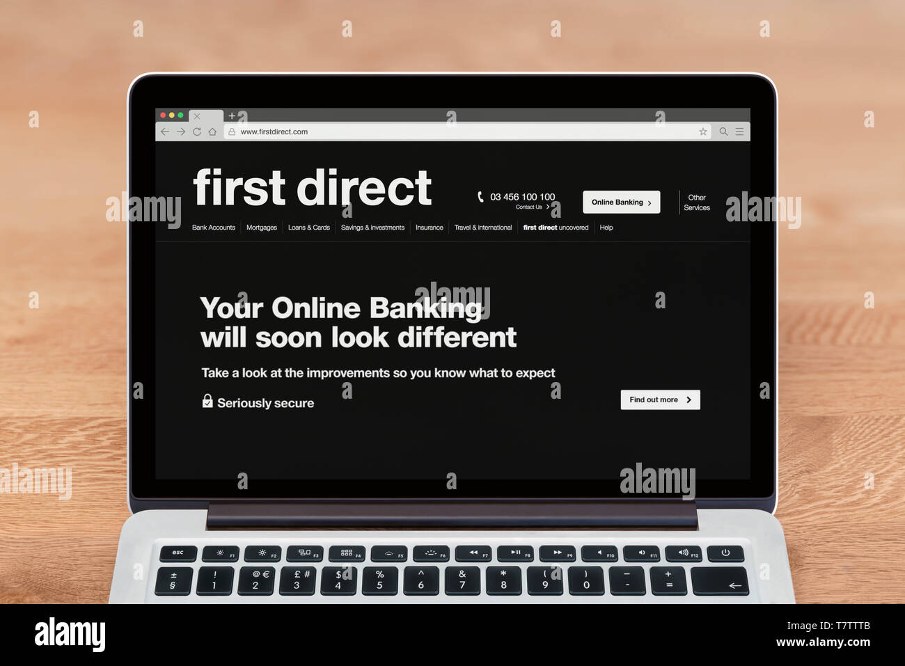 An Apple Macbook displays the First Direct bank website (Editorial use only). Stock Photo