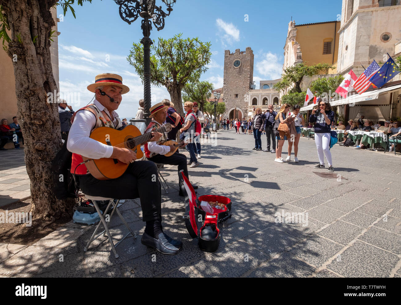 Street musicians performing on the Corsa Umberto, Taormina, Sicily. Stock Photo
