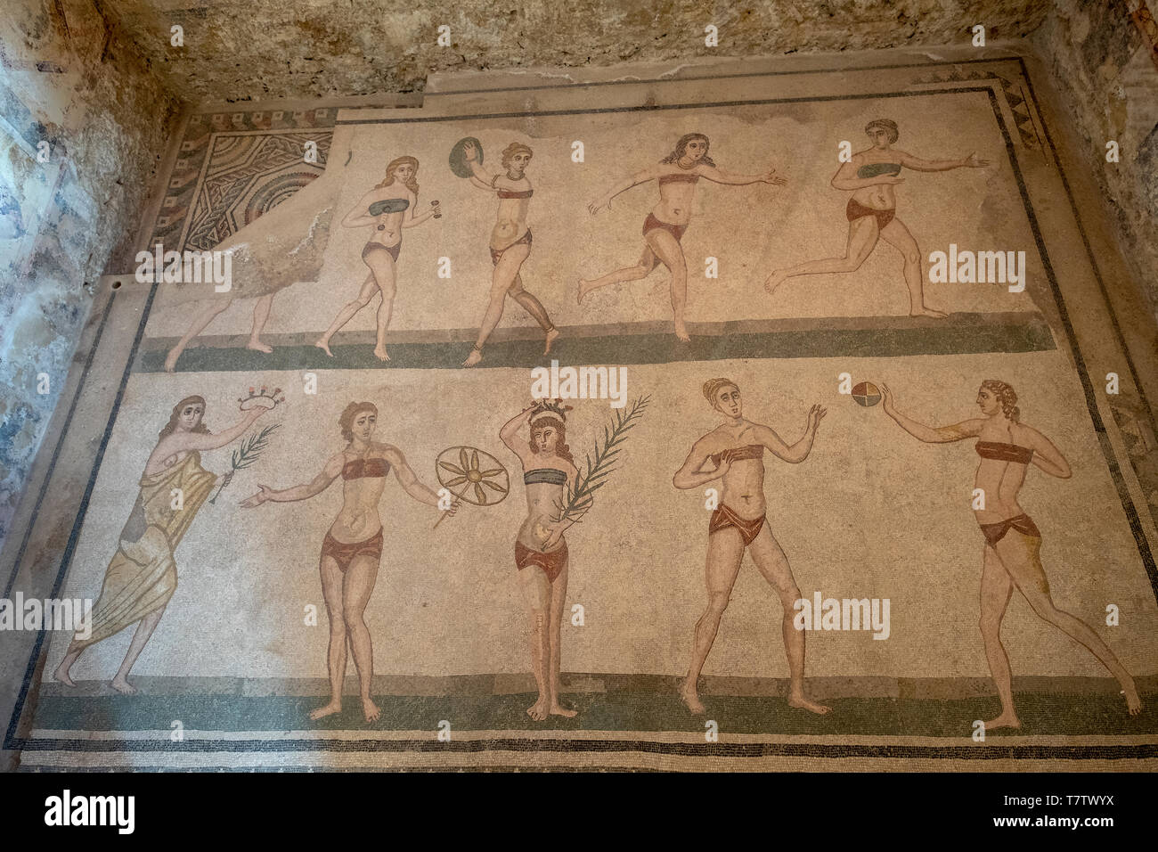 The 'bikini' mosaic, showing women playing sports, roman mosaic in the Villa Romana del Casale, Piazza Armerina, Sicily, Italy. Stock Photo