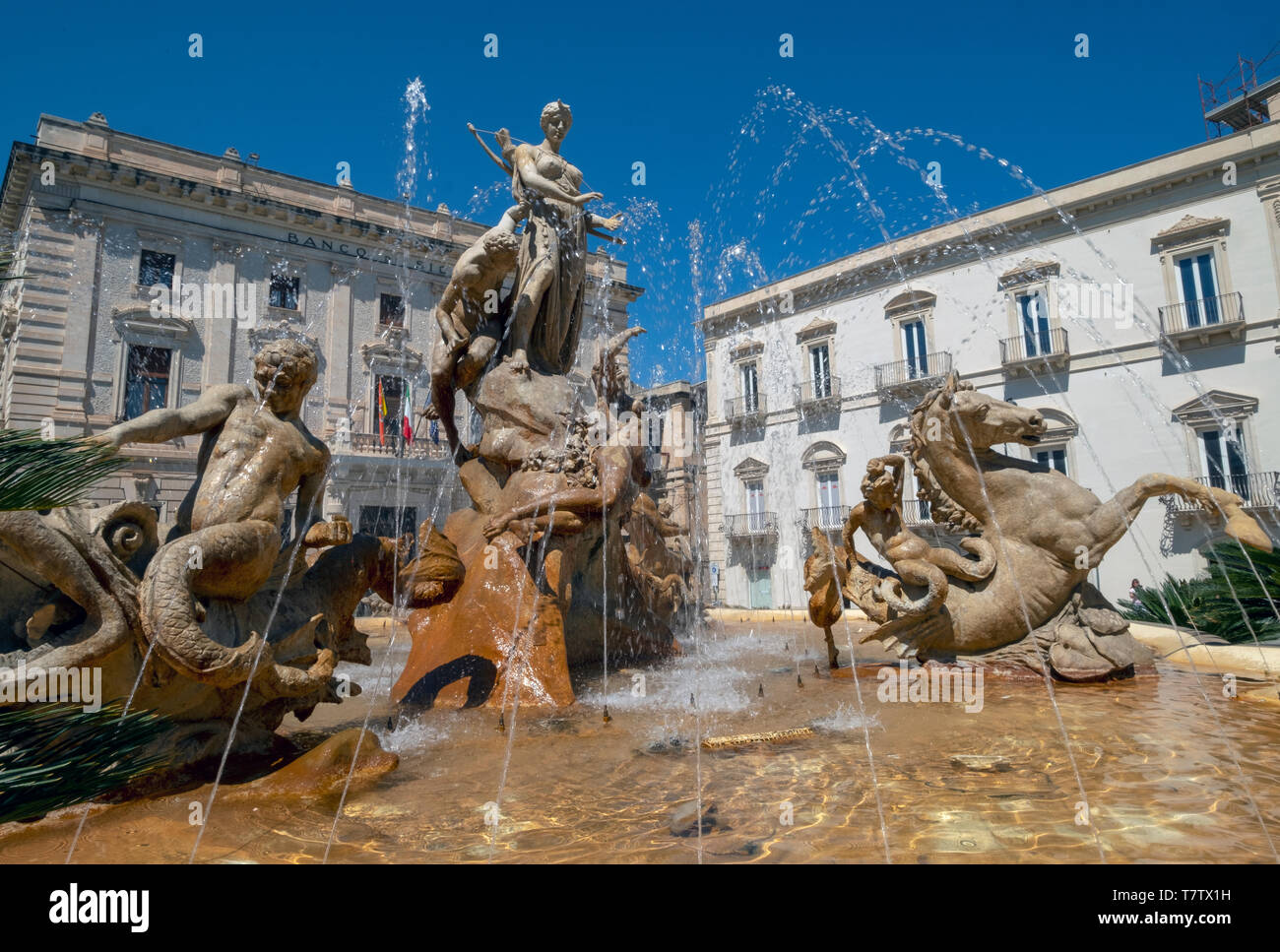 Artemis Fountain  (Diana Fountain) on Archimedes Square (Piazza Archimede)  Ortygia island, Syracuse, Sicily, Italy. Stock Photo