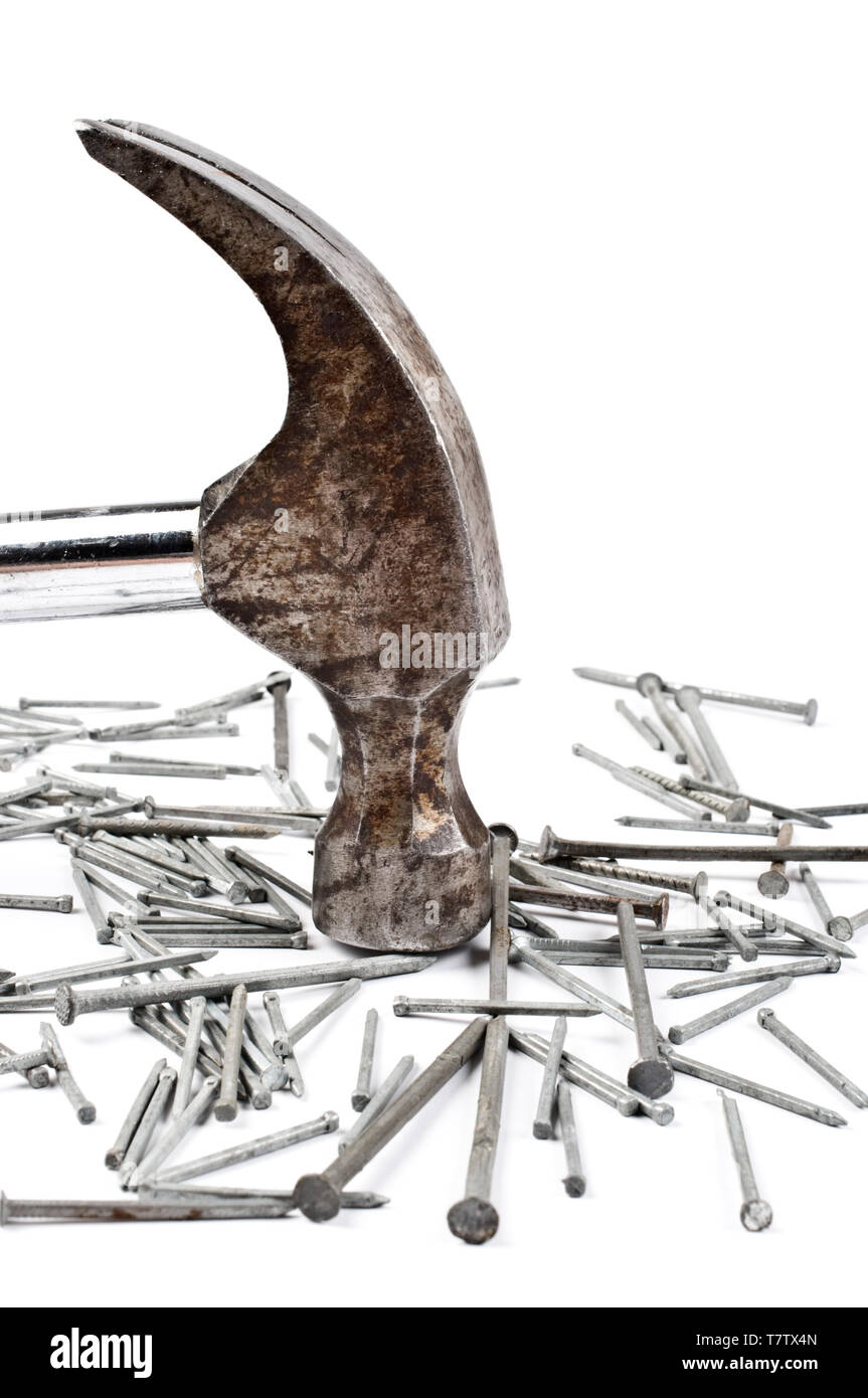 Claw hammer and nails on white background. Focus on hammer. Stock Photo