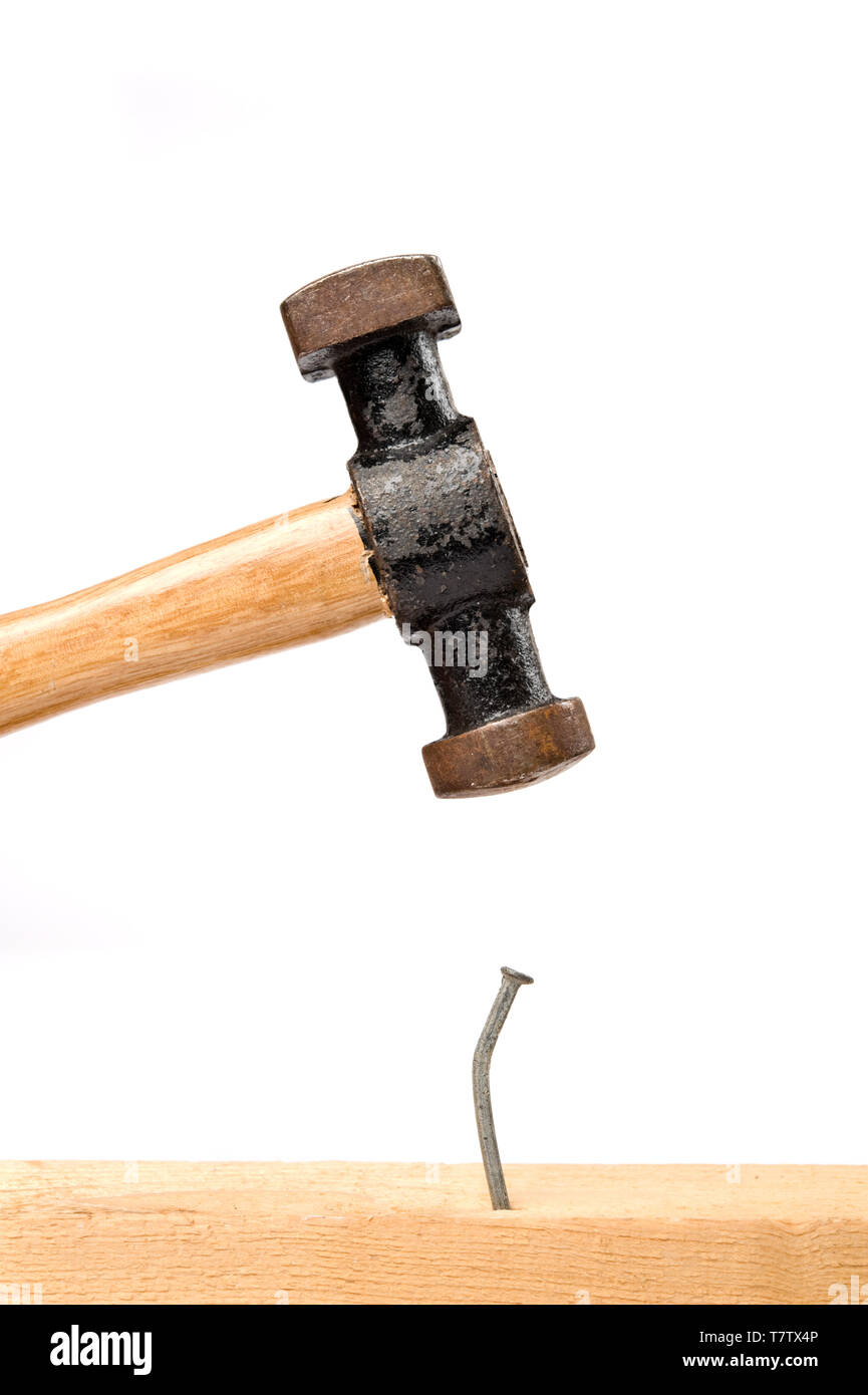 Hammer about to strike a nail hires stock photography and images Alamy