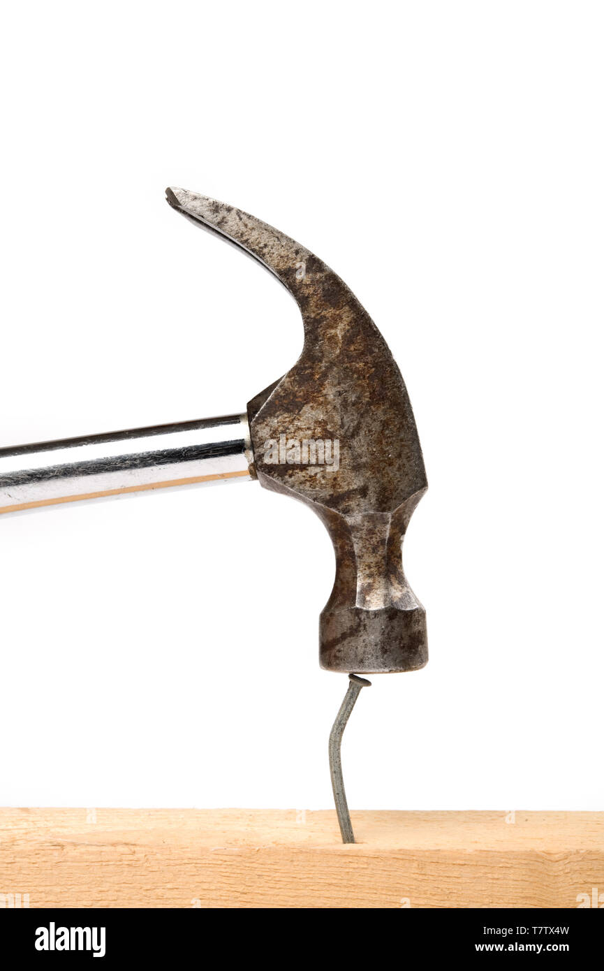 Hammer about to strike a nail hires stock photography and images Alamy