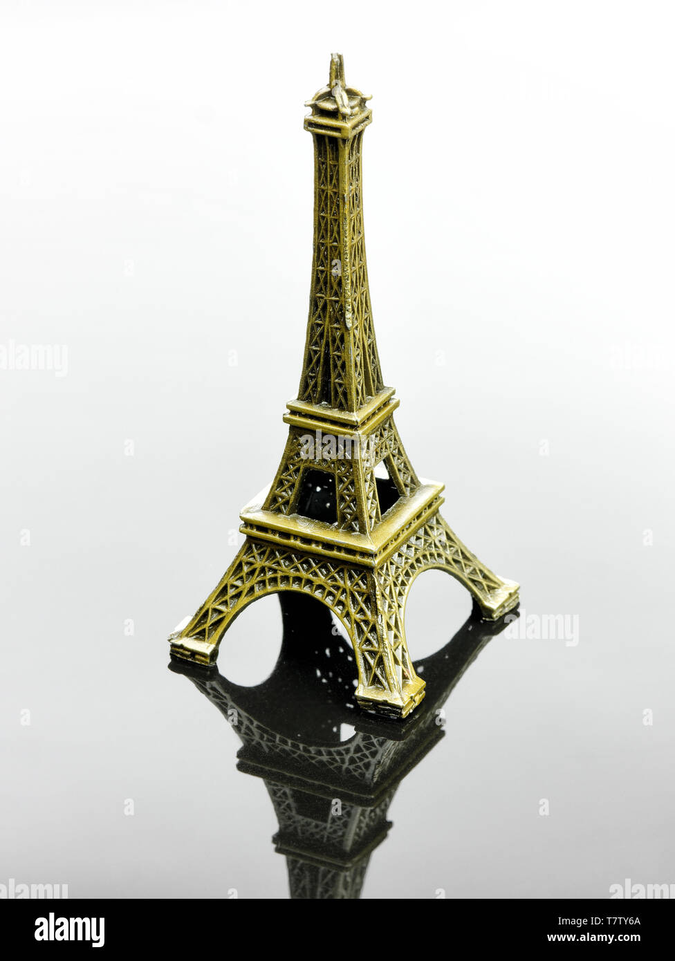 Small Eiffel tower Paris souvenir with reflection Stock Photo