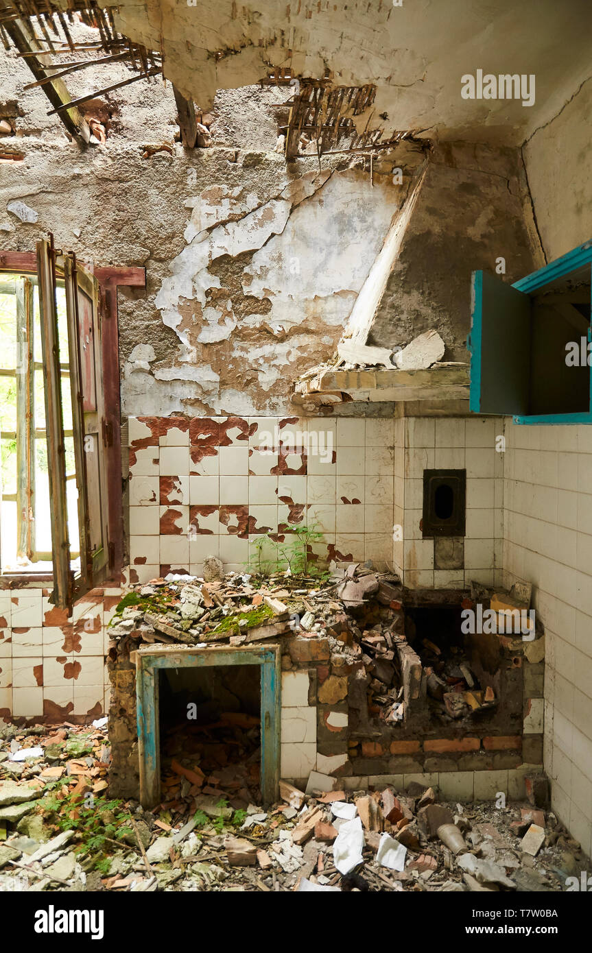 Interior of a room of the ruined facilities at the abandoned Canfranc International railway station (Canfranc, Pyrenees, Huesca, Aragon, Spain) Stock Photo