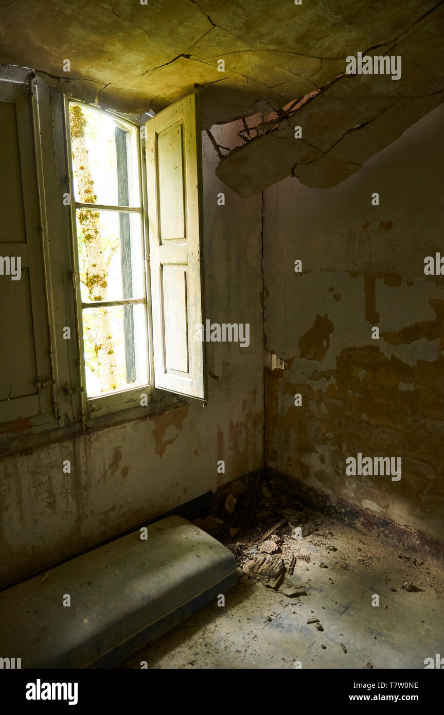 Interior of a room of the ruined facilities at the abandoned Canfranc International railway station (Canfranc, Pyrenees, Huesca, Aragon, Spain) Stock Photo