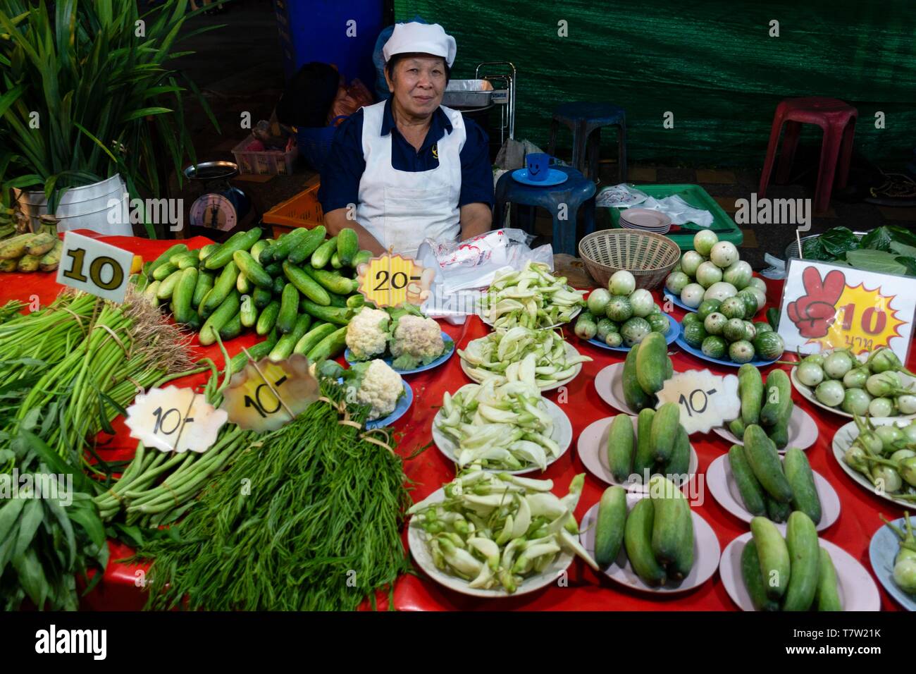 Seller with fresh vegetables, market, Chiang Rai, Northern Thailand, Thailand Stock Photo