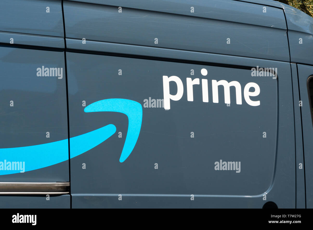 TEMPE, AZ/USA - APRIL 10, 2019: Amazon Prime delivery vehicle and trademark logo. Stock Photo