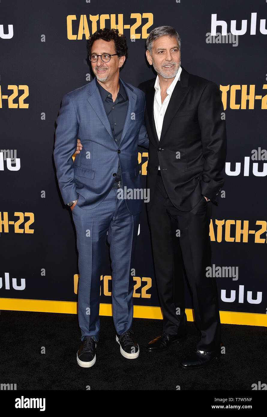 HOLLYWOOD, CA - MAY 07: Grant Heslov (L) and George Clooney arrive at the U.S. Premiere Of Hulu's 'Catch-22' at TCL Chinese Theatre on May 07, 2019 in Hollywood, California. Stock Photo